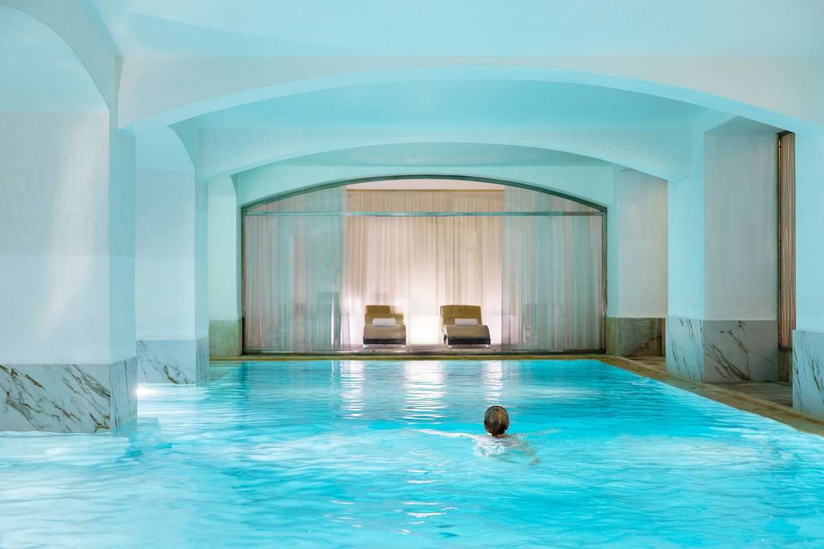 Indulge in Relaxation: Dive into the Tranquil Waters of Our Indoor Swimming Pool Image